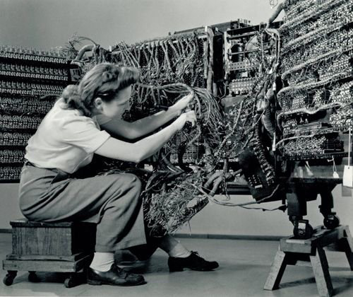 Woman engineer connecting wires