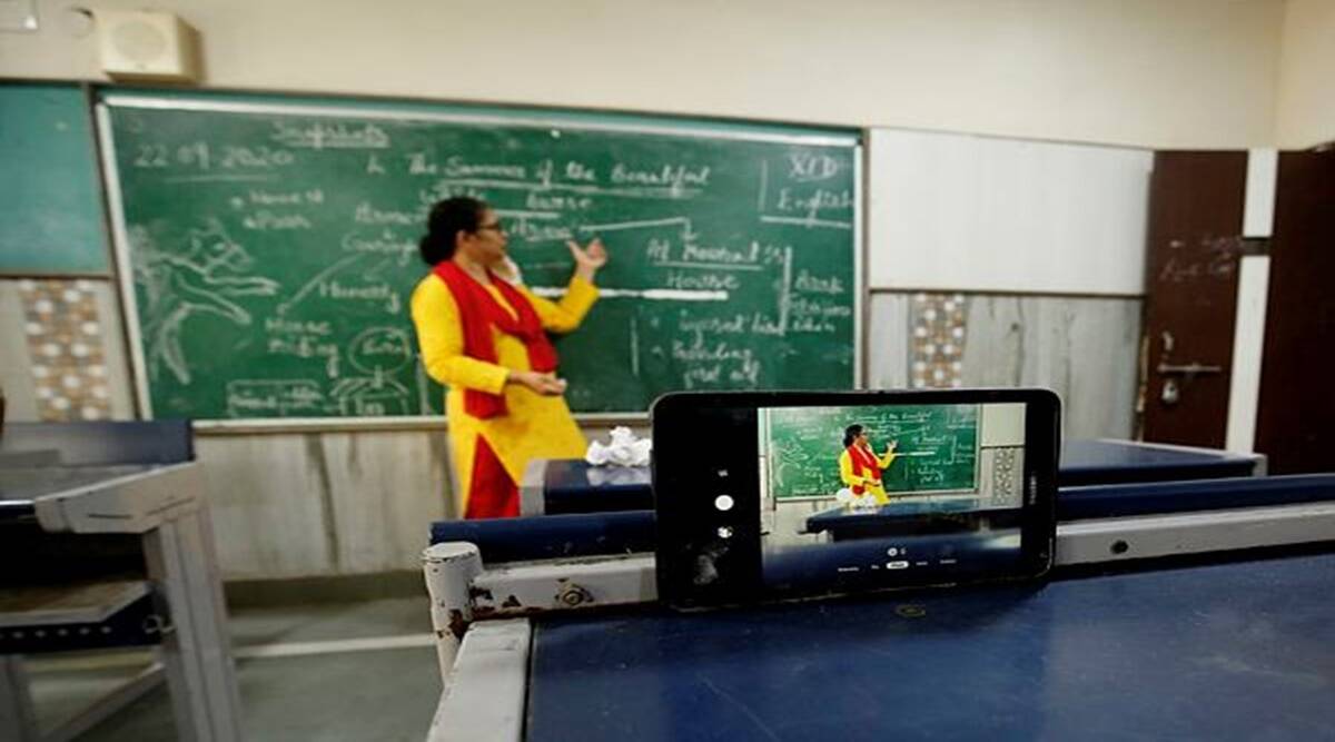 Teacher in front of the chalkboard